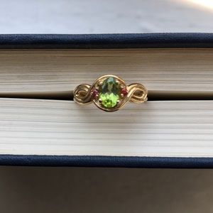 Gold ring with green and red stones